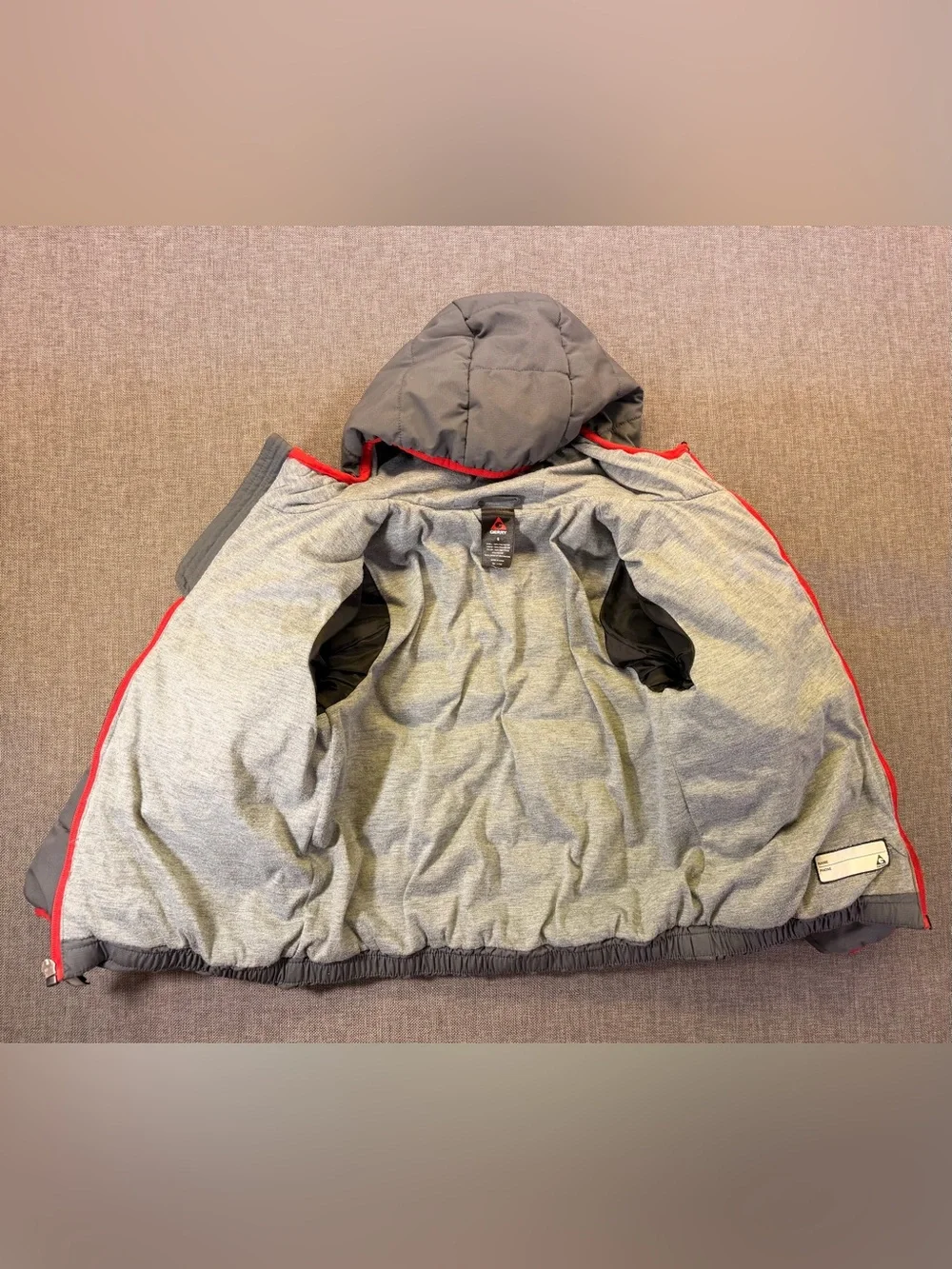 Gray Quilted Hooded Puffer Jacket with Red Trim size 6 kids.